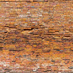 bulging brick wall needing brick reinforcement